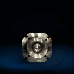 A metal object sitting on top of a black surface.