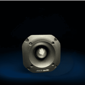 A silver speaker sitting on top of a black floor.