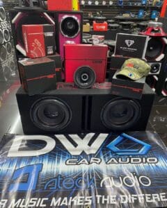A display case with some speakers and other electronics.