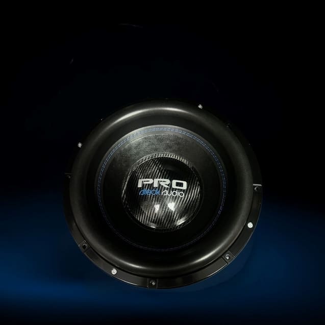 Black subwoofer speaker on dark background.