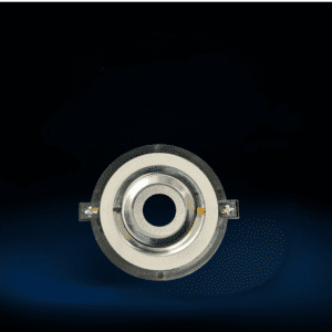 Metal circular component on dark background.